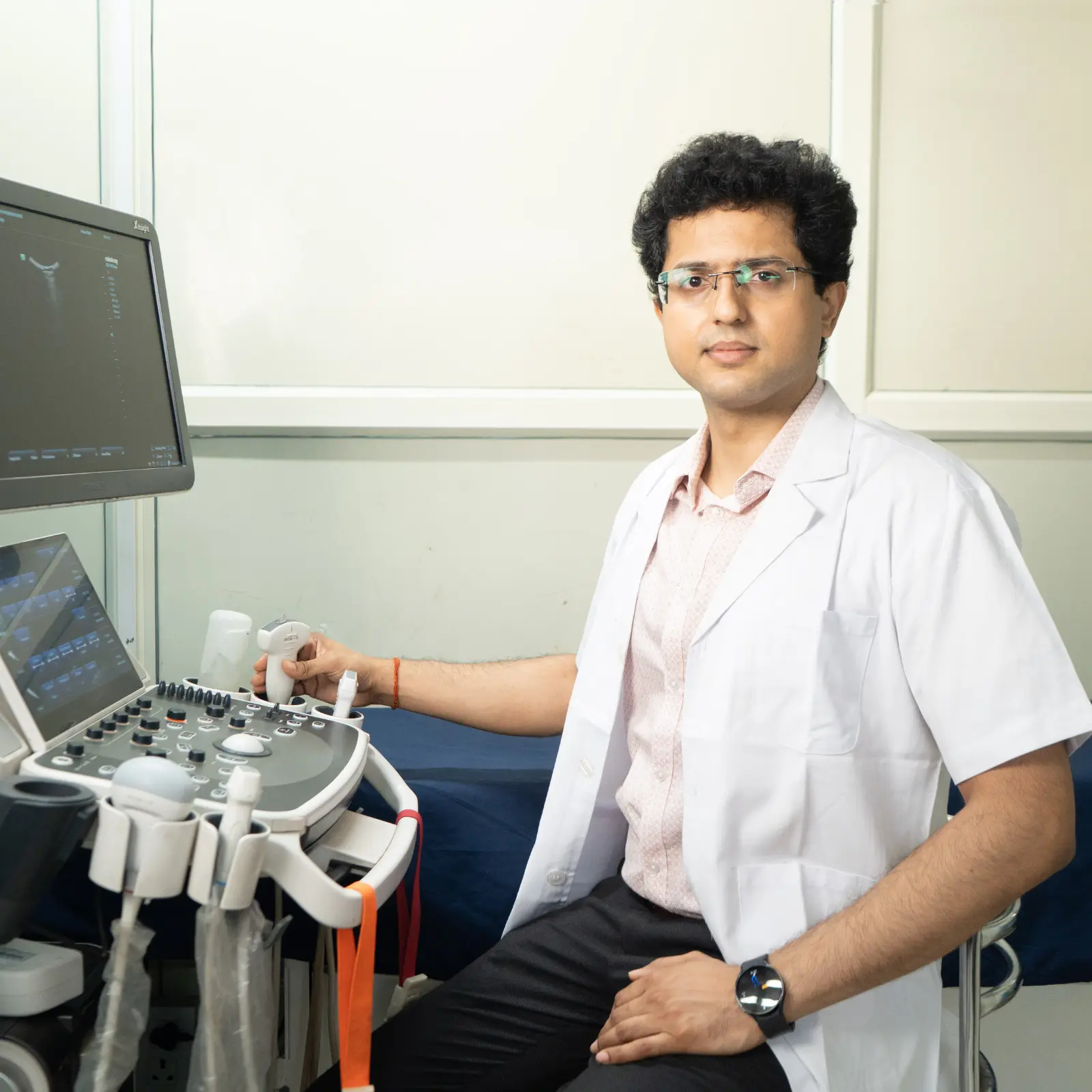 Beautiful young female doctor looking at camera in the office.